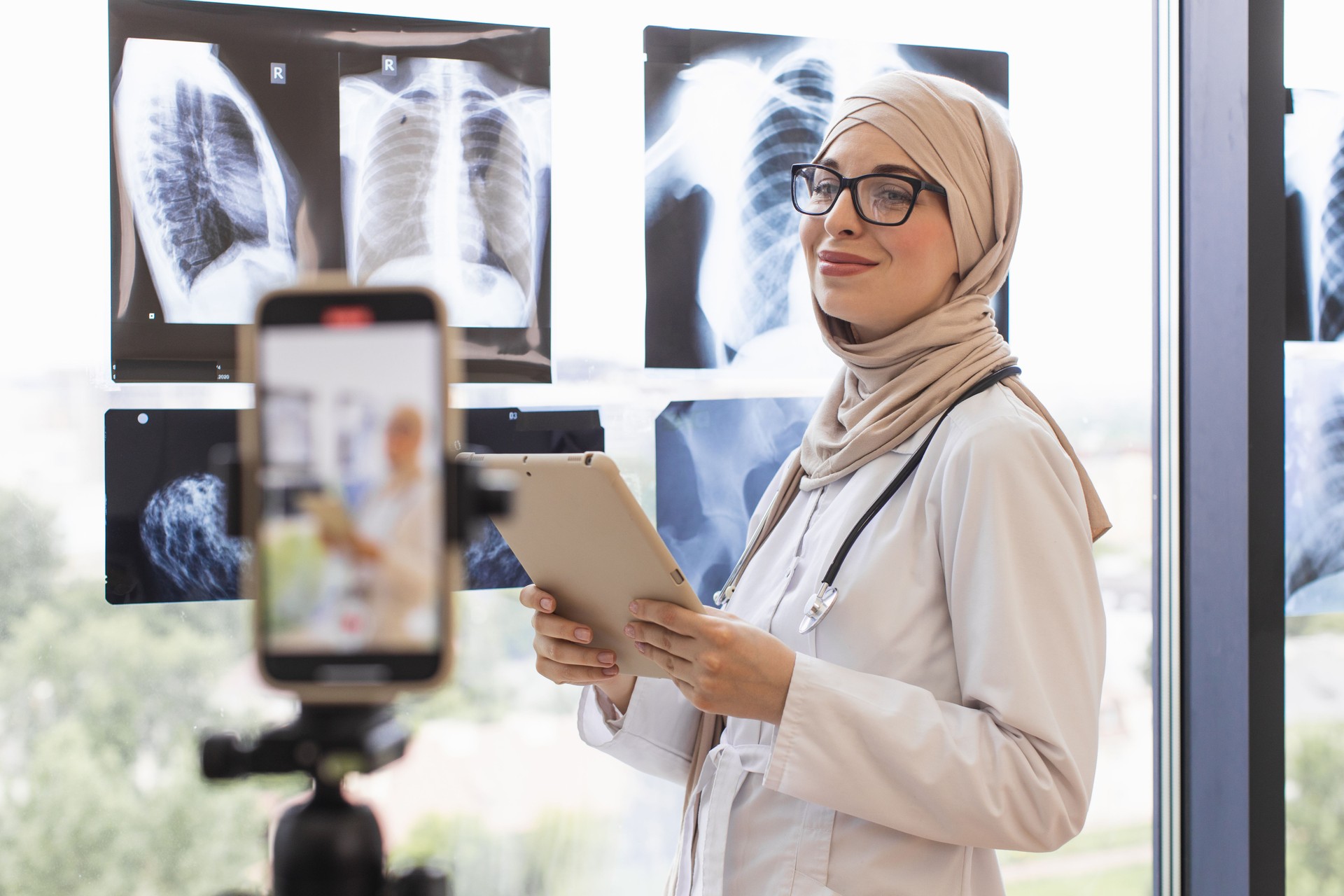 Muslim woman doctor records medical lesson using x-rays and smartphone