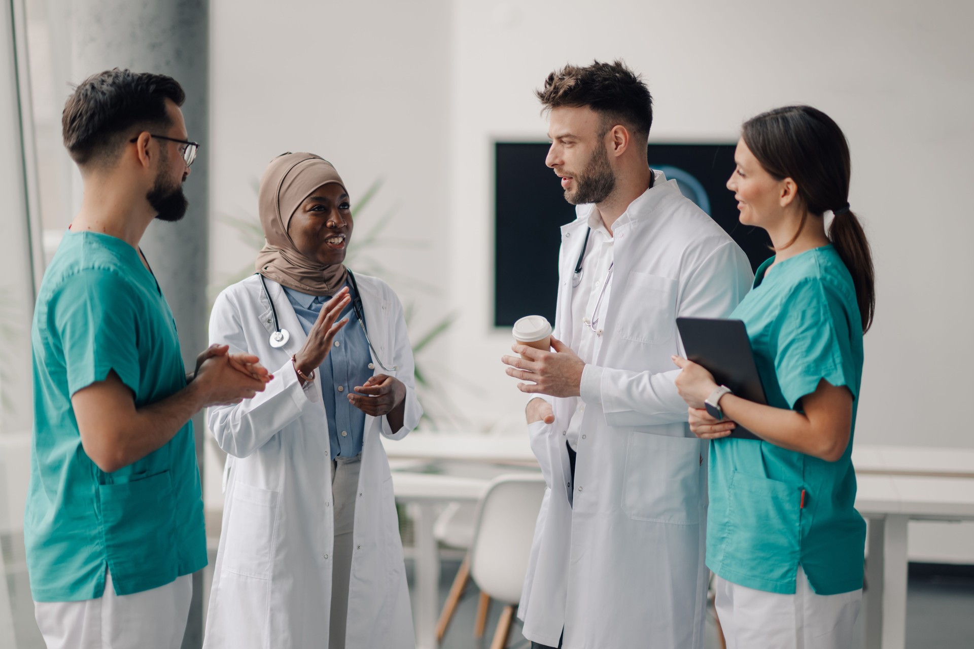 Medical team discussing patient cases during hospital break